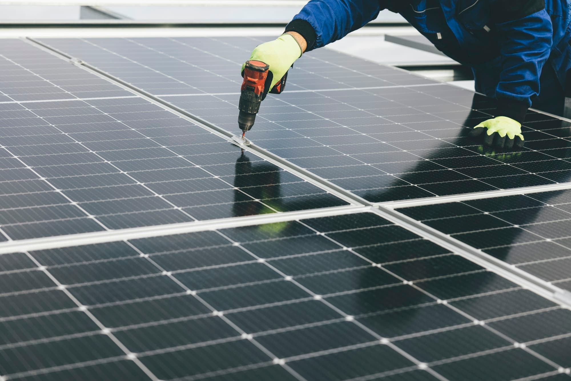 Technician installing a solar panel